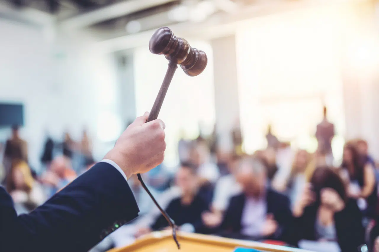 British property auctioneer with raised gavel