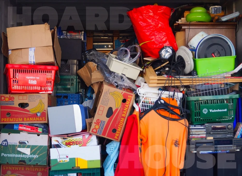 A room packed floor to ceiling with boxes, crates and old belongings in a hoarder's house
