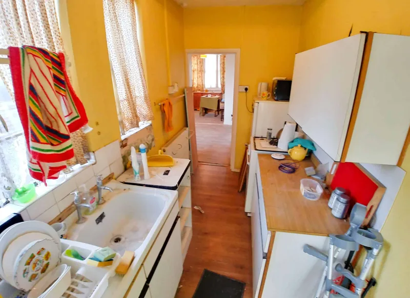 Dated kitchen interior of a Crouch End, London period house requiring modernisation, of the type that sold at auction for £766,000