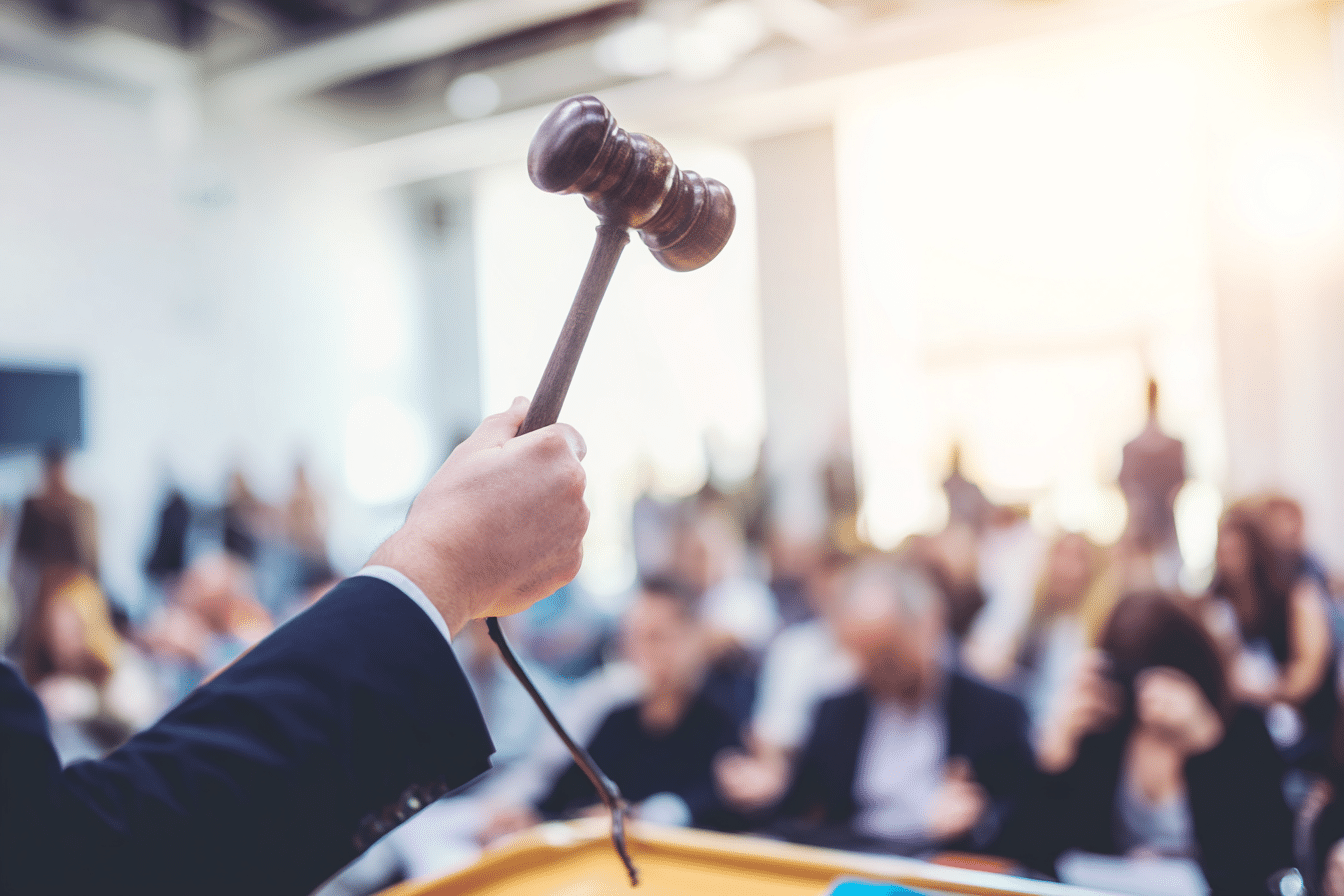 Property auctioneer with gavel in hand